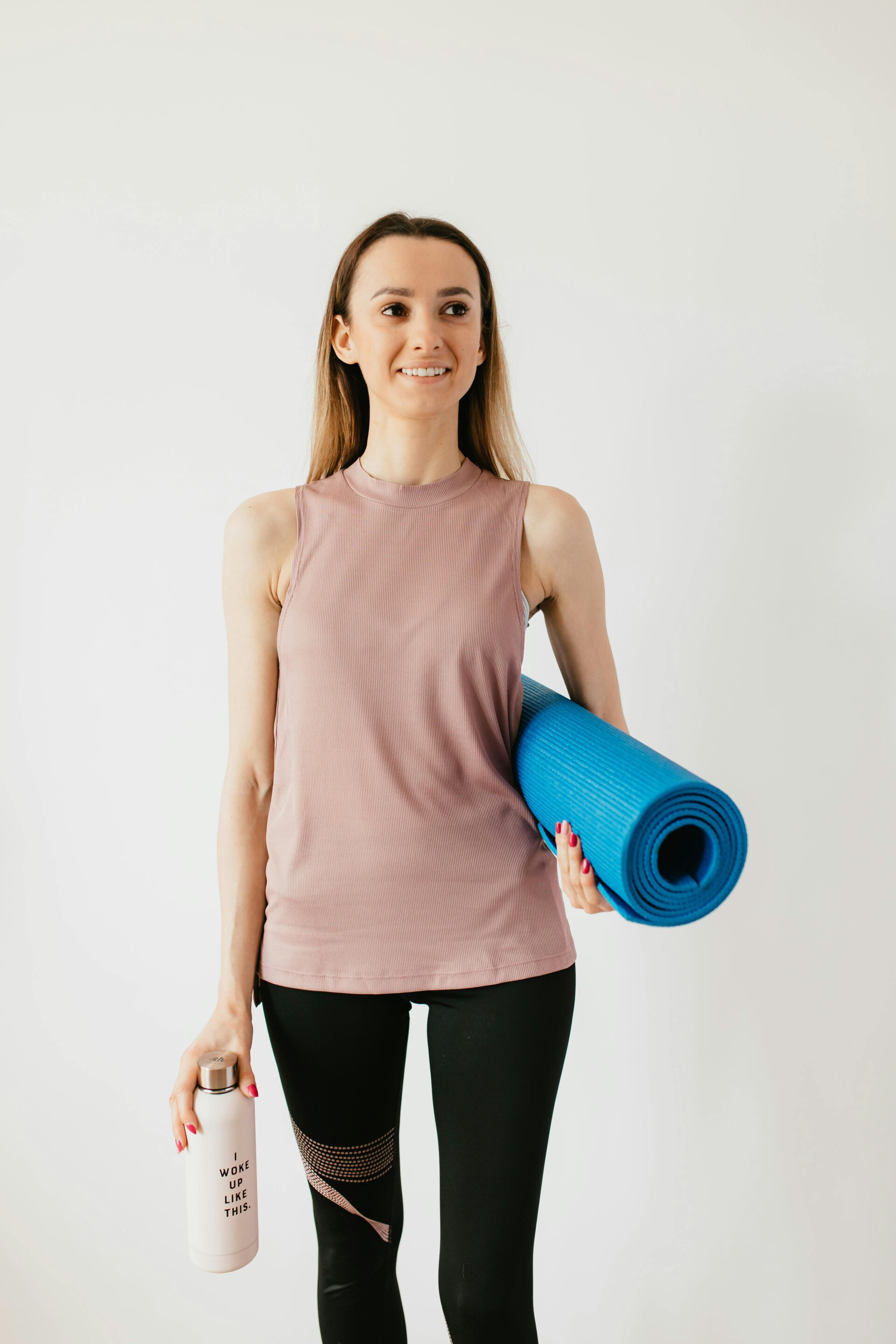 Women's dusty rose seamless ribbed yoga tank with ergonomic support sourced by Diamond Attires.
